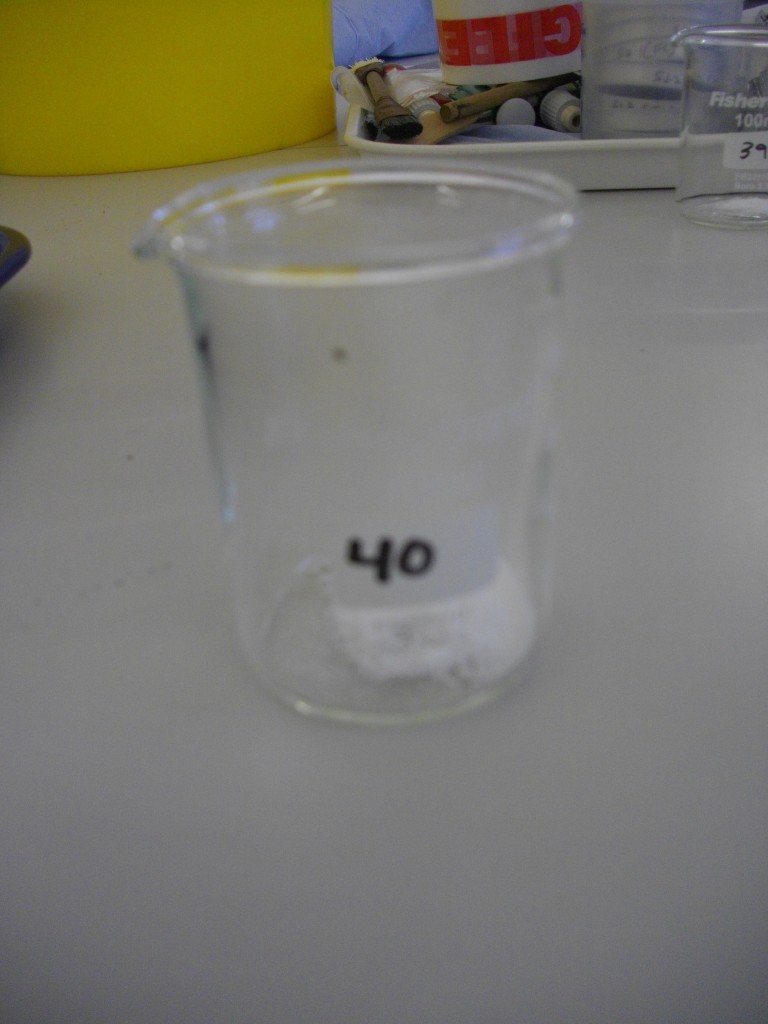 Metaphosphate powder in glass beaker